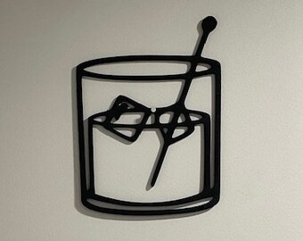 May include: Black and white line art illustration of a glass of ice with a stirrer. The glass is filled with ice cubes and a stirrer is in the glass.