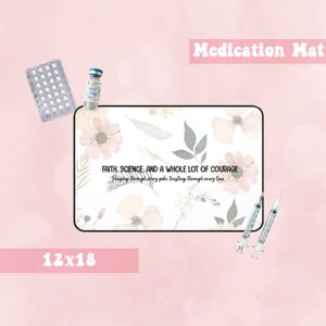 May include: A rectangular medication mat, 12x18 inches, with a floral design and the text "FAITH, SCIENCE, AND A WHOLE LOT OF COURAGE." The image includes pills, a vial, and syringes. The mat is designed for organizing medications.