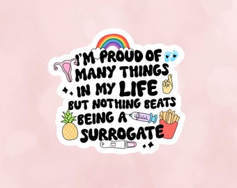 May include: A white sticker with a rainbow, a uterus, a syringe, a pineapple, a pregnancy test, a red box of french fries, and the text "I'm proud of many things in my life but nothing beats being a surrogate."
