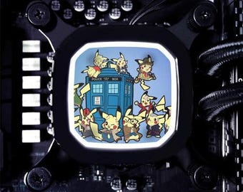 May include: A computer cooling fan with a white light, featuring a cartoon image of a blue police box with multiple yellow Pikachu characters surrounding it. The text "POLICE BOX" is visible on the police box.