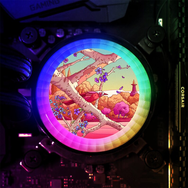 May include: A circular light with a rainbow spectrum around the edge. The centre of the light shows a cartoon illustration of a bird perched on a branch in a woodland setting.