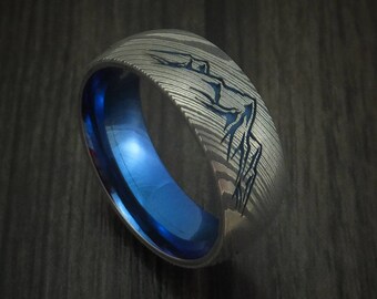 Damascus Steel Men's Ring With Mountain Range And Anodized Titanium Interior Sleeve Custom Made