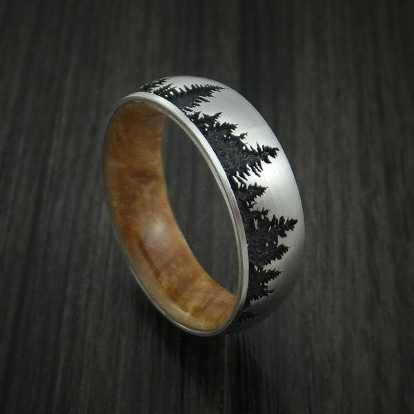 Titanium ring with tree design and maple burl hardwood sleeve custom made band
