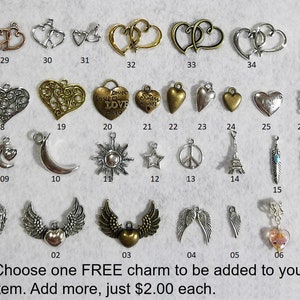 May include: A selection of 36 silver and gold charm pendants, including hearts, moons, stars, feathers, and more. Choose one free charm to be added to your item. Add more for $2.00 each.