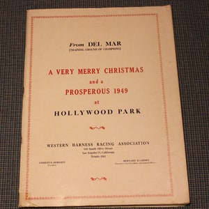 May include: A vintage white card with red text wishing a Merry Christmas and a Prosperous 1949 from Del Mar, the training ground of champions, at Hollywood Park. The card includes the address and phone number for the Western Harness Racing Association.