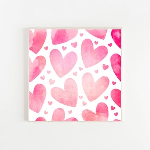 May include: A white background with a pattern of pink watercolour hearts of different sizes. The hearts are layered on top of each other, creating a sense of depth and dimension.