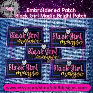 May include: Four embroidered patches with the text "Black Girl Magic" in pink and yellow lettering on a black background. The patches have a blue and white border.