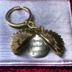 Gold and silver Sunflower hidden message keychain purse charm. Keep F&cking going. Inspire, motivate, cancer warrior