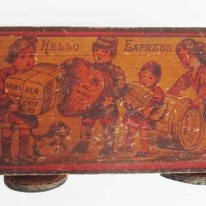 May include: A vintage wooden toy truck featuring a painted illustration of children transporting parcels and a barrel. The words "Hello Express" are painted on the top. The truck has a wooden handle and wheels.
