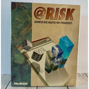 May include: A box for the software "@RISK" for advanced risk analysis for spreadsheets. The box features dice, a spreadsheet graphic, and three stylized columns with sky and landscape imagery. The text "PALISADE" is at the bottom.