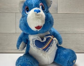 Peluche vintage de oso cariñoso con forma de corazón arcoíris, estilo oso azul, años 80
