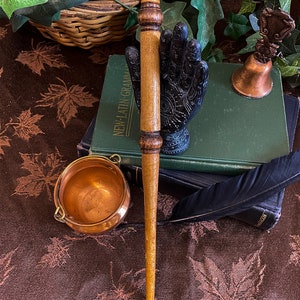 Wand — Pine; Thunderbird feather; 11 1/4 inches; Slightly swishy
