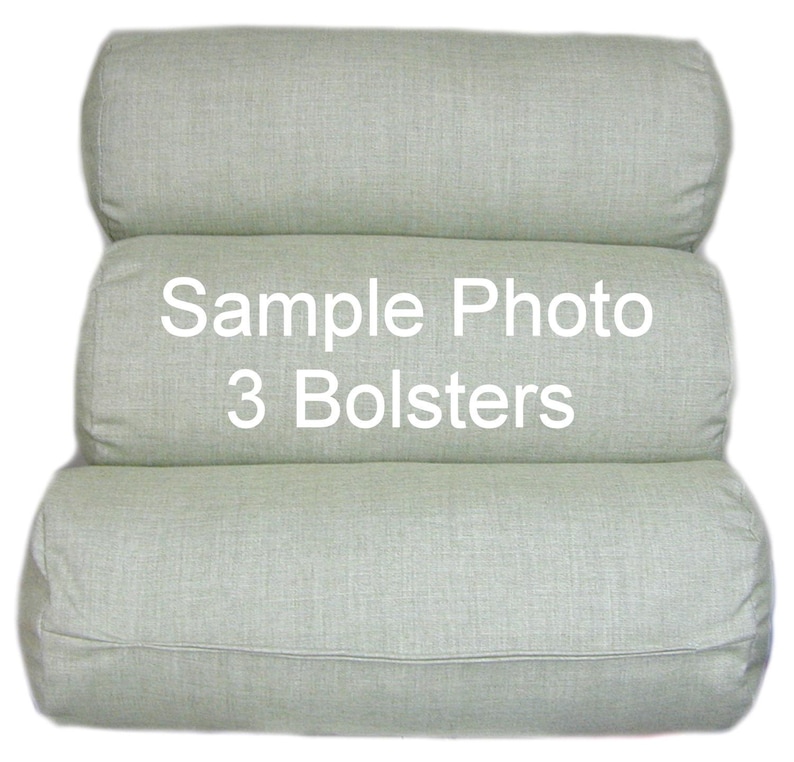 May include: Three light green cylindrical bolsters stacked on top of each other. The middle bolster has the text "Sample Photo 3 Bolsters" printed on it.