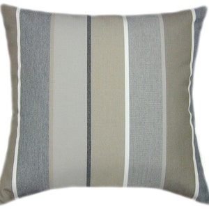 May include: A striped throw pillow with beige, gray, and white stripes. The pillow is made of a soft, textured fabric.