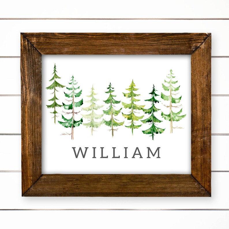 May include: A framed print with a watercolor illustration of a row of green pine trees. The name "WILLIAM" is printed below the trees.
