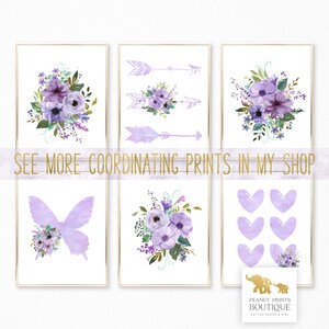May include: Set of six printable wall art prints featuring purple and green floral designs, butterflies, arrows, and hearts. The prints are perfect for a nursery or child's room. "See more coordinating prints in my shop" text is included.