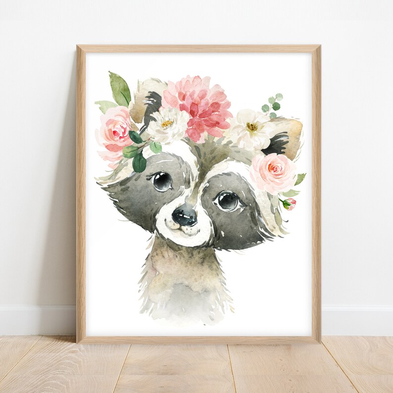 May include: A watercolor painting of a raccoon wearing a flower crown. The raccoon has a pink nose and black eyes. The flowers in the crown are pink, white, and green.