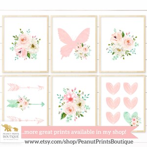 May include: Set of six printable nursery art prints featuring floral bouquets, butterflies, arrows, and hearts in pink and green watercolor designs. The prints are perfect for a baby girl's nursery or a child's bedroom.