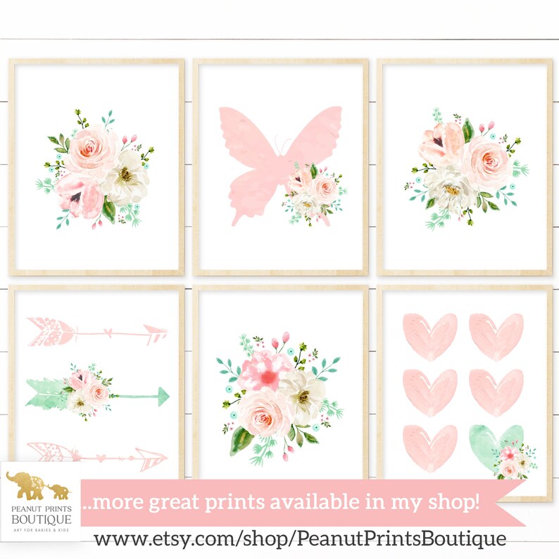 May include: Set of six printable nursery art prints featuring floral bouquets, butterflies, arrows, and hearts in pink and green watercolor designs. The prints are perfect for a baby girl's nursery or a child's bedroom.