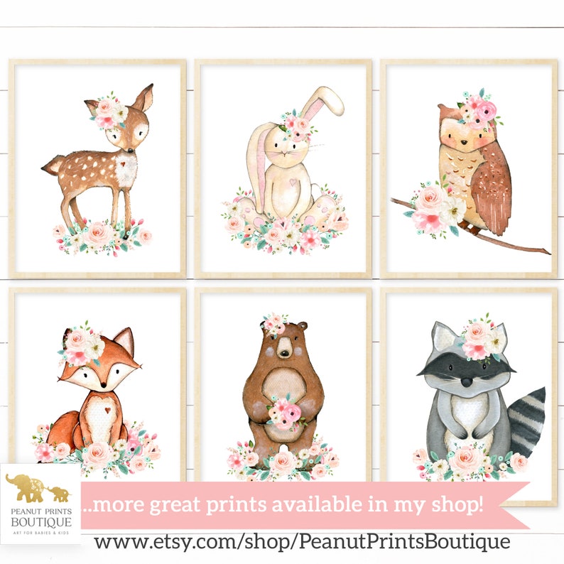 May include: Set of six watercolor illustrations featuring woodland animals with floral crowns. The animals include a deer, rabbit, owl, fox, bear, and raccoon. Each animal is surrounded by pink and white flowers.