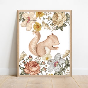 May include: A watercolor illustration of a brown squirrel holding a nut, surrounded by a variety of flowers in shades of pink, yellow, and white. The flowers are arranged in a whimsical pattern, creating a charming and nature-inspired design.