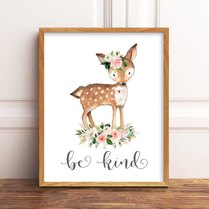 May include: A watercolor illustration of a fawn with a floral crown, standing on a bed of pink and white flowers. The text "be kind" is written below the fawn.