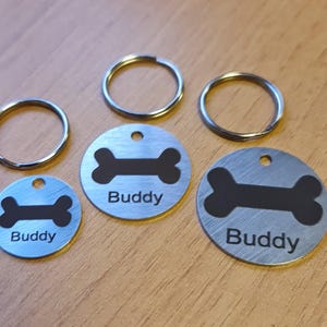 Bespoke, personalised &quot;dog bone&quot; ID discs / ID tags / name tags, for dogs and puppies. Engraved specially to your individual requirements.