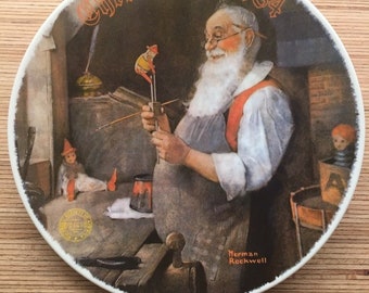 Santa In His Workshop by Norman Rockwell