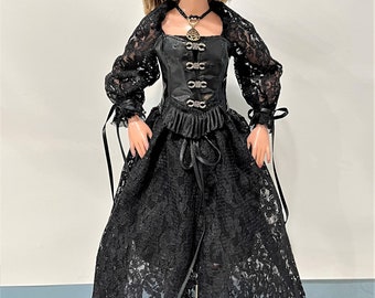 May include: A black lace dress with a black corset top and a black hat with a veil. The doll is wearing black boots and a silver necklace with a pendant.