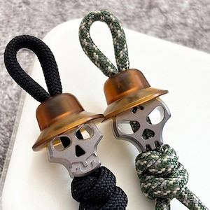 Punk Schädel PEI / Titan Legierung Perlen DIY Anhänger Paracord Perle Schlüsselbund Werkzeug Zubehör