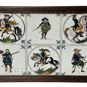 May include: A set of six hand-painted tiles in a dark wooden frame, depicting figures on horseback and on foot. Each tile features a circular design with a detailed illustration, creating a vintage aesthetic.