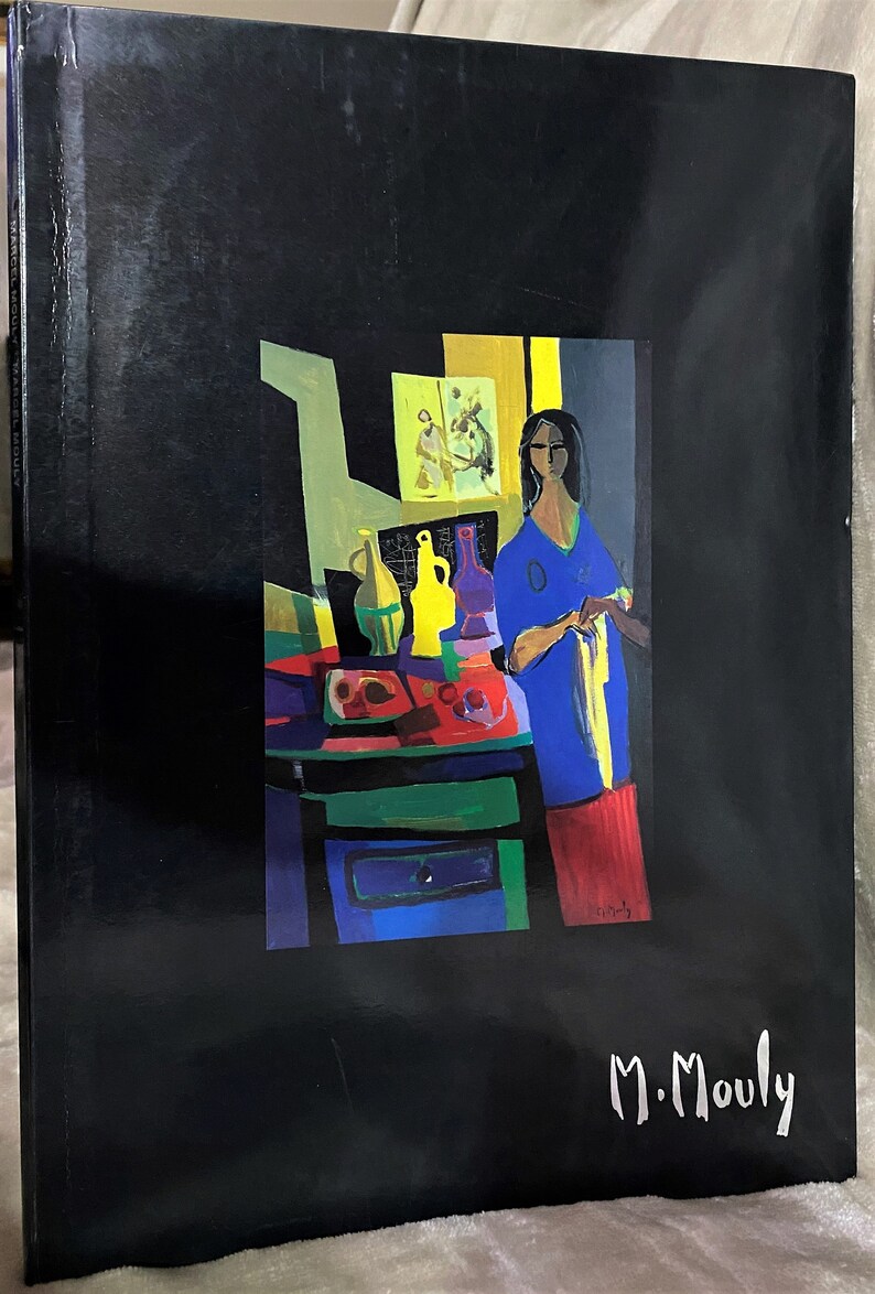 May include: A painting of a woman in a blue shirt and red skirt standing in a room with a table and several bottles. The painting is signed "M. Mouly" in the bottom right corner.