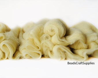 May include: A pile of soft, pale yellow wool roving. The wool is fluffy and textured, perfect for felting or spinning.