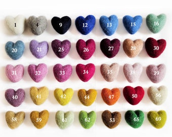 May include: A collection of 69 felt hearts in various colors, numbered 1 through 69. The hearts are arranged in rows of seven, with the numbers visible on each heart.