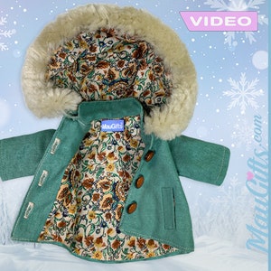 May include: A teal blue hooded jacket with a brown floral lining and brown buttons. The jacket has a faux fur trim around the hood. The jacket is made for a doll or small stuffed animal.