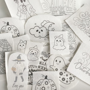 May include: A set of 12 black and white printable Halloween themed images. The images include ghosts, pumpkins, a witch, a spider web, and the text "Boo you where" and "31 October".