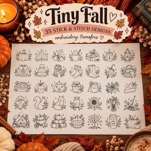 May include: A sheet of 35 stick and stitch embroidery transfer designs titled Tiny Fall. The black line art illustrations feature autumn-themed icons including pumpkins, leaves, acorns, a sweater, a scarf, boots, a fox, an owl, and a squirrel.