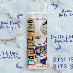 May include: A stainless steel tumbler with a white lid and straw. The tumbler features a collage design with the word "CAROLINA" and images of North Carolina. It has a leak-proof sliding lid and double-wall insulation.