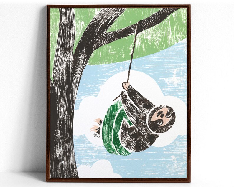 An art print of a happy brown sloth swinging from a tree in a green tire swing as white clouds float over a baby blue sky