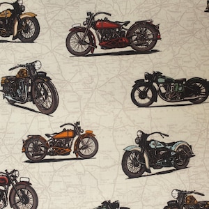 May include: A fabric featuring a repeating pattern of vintage motorcycles in various colours, including black, red, and orange. The motorcycles are set against a map-like background, creating a retro aesthetic. Suitable for apparel or home decor.