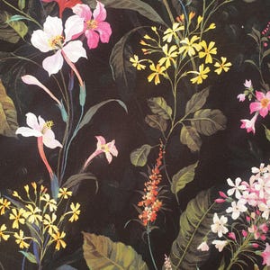 May include: A dark black fabric featuring a botanical print with various flowers in shades of white, pink, yellow, and orange, interspersed with green leaves and stems. The pattern displays a dense arrangement of diverse floral species.