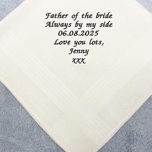 May include: White handkerchief with black embroidered text: "Father of the bride Always by my side 06.08.2025 Love you lots, Jenny xxx"