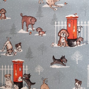 May include: A light blue fabric with a repeating pattern of dogs, red mailboxes, and small birds in a snowy landscape. The dogs are various breeds and colors, some interacting with the mailboxes and letters.