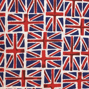 May include: White fabric with a repeating pattern of red, white, and blue Union Jack flags. The flags are stylized and have a slightly distressed look.