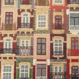 May include: A tapestry fabric with a repeating pattern of windows with balconies. The windows are in various colours, including red, green, blue, and white. The balconies are made of black metal.