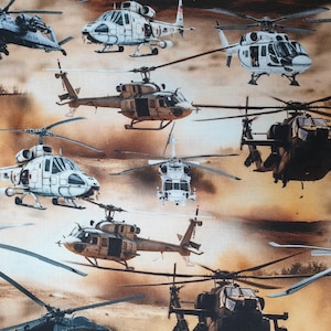 May include: A fabric pattern featuring various military helicopters in flight. The helicopters are in shades of white, brown, and black, set against a backdrop of a sunset or desert landscape. The design is repeated across the fabric.