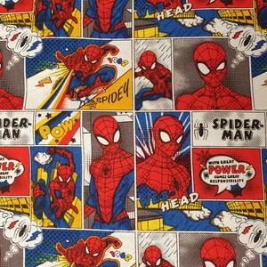 May include: Comic book fabric featuring Spider-Man in various action poses. The design includes speech bubbles with phrases like "Pow" and "With great power comes great responsibility." The color palette is dominated by red, blue, and yellow.