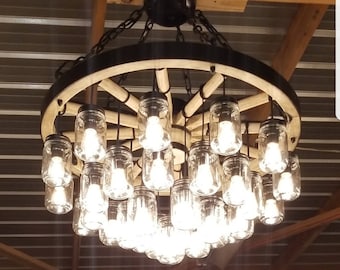 A Wagon Wheel Chandelier with a mix of rustic vintage features and finishing techniques creating a unique handcrafted chandelier