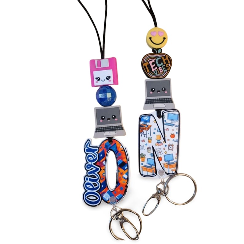 May include: Two lanyards with tech-themed charms. One features the name "Oliver" and a letter "O" charm. The other has a letter "N" charm with a desk scene. Both have computer, floppy disk, and smiley face charms.
