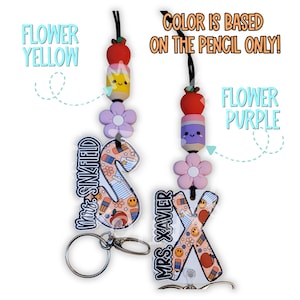 May include: Two personalized teacher lanyards with the names "Mrs. Sinkfield" and "Mrs. Xavier". Each lanyard features a letter, a flower, and a pencil-shaped bead. The text "Color is based on the pencil only!" is also visible.